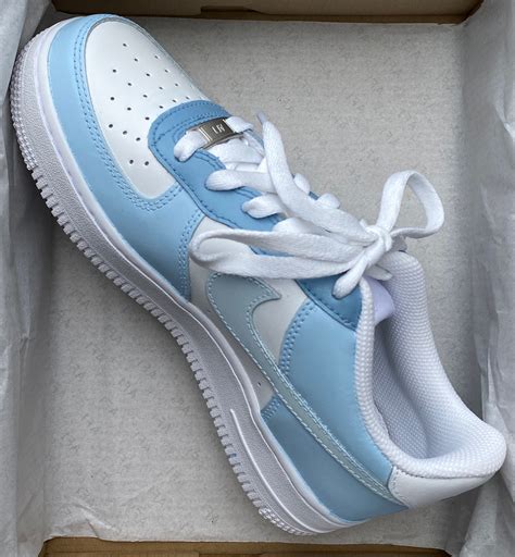 air force 1 blaues nike zeichen|blue air force 1 shoes.